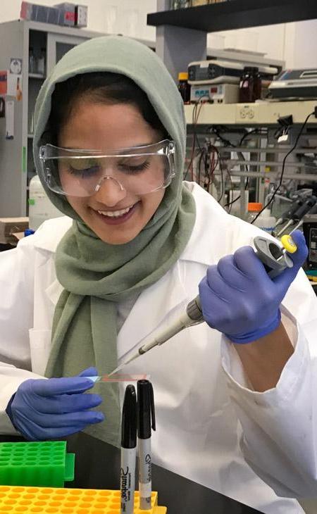 Photo of student Anam Adil in the lab