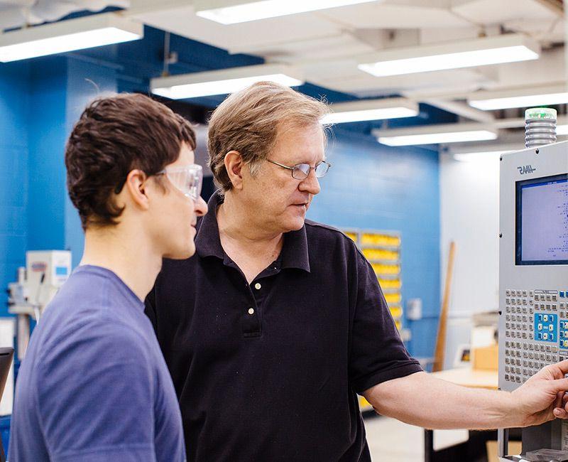 Craig Johnson with Student in the Armour Machine Shop